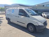 a white van that is parked in a parking lot
