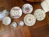 many different types of plates and bowls on the floor