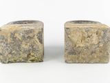 these are two pieces of stone sitting on top of each other