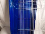 a cage that has a blue tray and a yellow tray