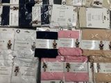 many different types of men ' s clothing on the table
