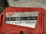 a close up of a red tool on a table