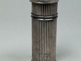an antique silverplated salt shaker with a domed top