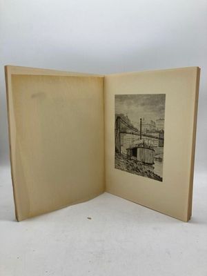 an open book with a picture of a bridge in the background