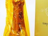 a bottle of champagne that is wrapped in plastic
