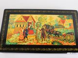 painting on a black box with a painting of a man and a woman in a carriage