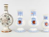 three vases are sitting next to each other on a white surface