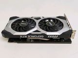 a close up of a video card with two fans on top of it