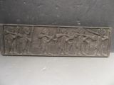 an image of a stone plaque with a group of people on it