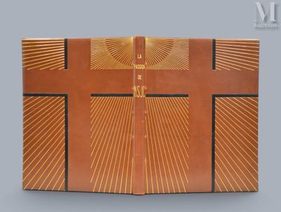 a close up of an open book with a cross on it