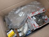 a cardboard box filled with assorted items in it
