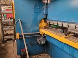 an image of a machine that is working on a piece of metal
