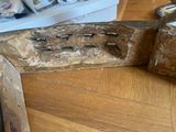 a piece of wood that has been cut in half on the floor