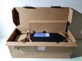 a cardboard box with a remote control inside of it