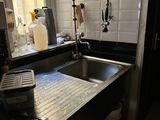 a kitchen with a sink and a window in it