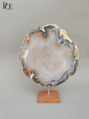 an image of a white and blue agate on a wooden stand