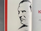an open book with a drawing of a man ' s face on it