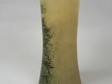a vase that is sitting on a white surface