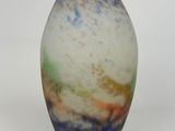 a vase that is sitting on a white surface
