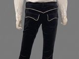 an image of a mannequin wearing a white shirt and black pants