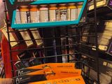 a man that is looking at some items in a store