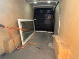 an image of the inside of a van with the door open