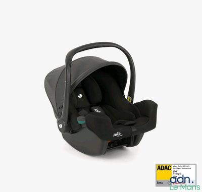 a baby car seat in the middle of a white background