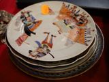 a lot of plates stacked on top of each other on a table
