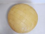 a large round yellow pillow on the floor