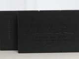 a couple of black boxes sitting on top of a table