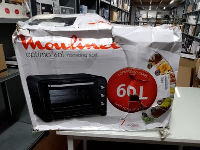 a microwave sitting on top of a table in a store
