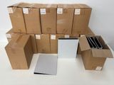 a pile of boxes sitting on a table next to a laptop
