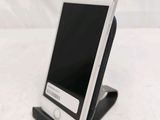 a cell phone that is sitting on top of a stand