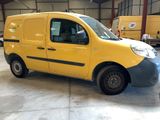 a yellow van that is parked in a garage