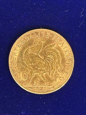 l'image d'une pièce de monnaie sur laquelle figure un coq, sur un fond bleu