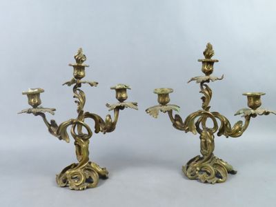 pair of antique brass candelabs with flowers and leaves
