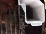 a black toaster with a white lid on a counter