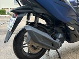 a motorcycle that is parked on the street in front of a building