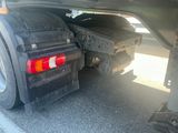 a black truck with a flat bed and a flat bed