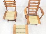 three wooden chairs and a foot stool sitting on a white floor