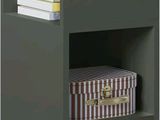 bedside table with two drawers and a clock on top of it