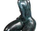 statue of a woman sitting on her knees on a white background
