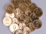 a lot of coins that are on the table