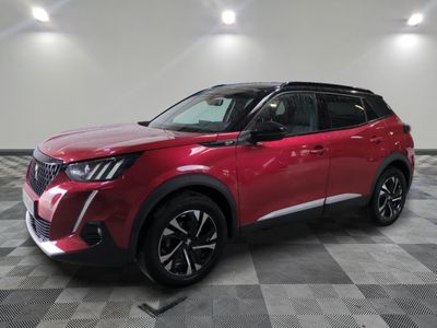 a red suv parked in a room with a checkered floor