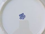 a white plate with a blue and white design on it