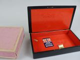an open box with a card inside of it and a small box with a card inside of it