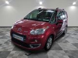 the red citrole is parked on a checkered tile floor