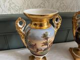 two vases that are sitting on a table