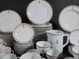 a lot of plates and cups on the table