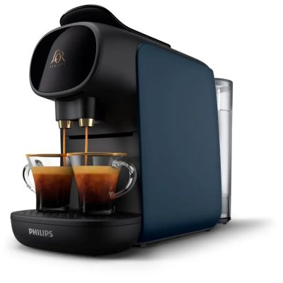 a blue coffee machine with two cups of coffee in front of it